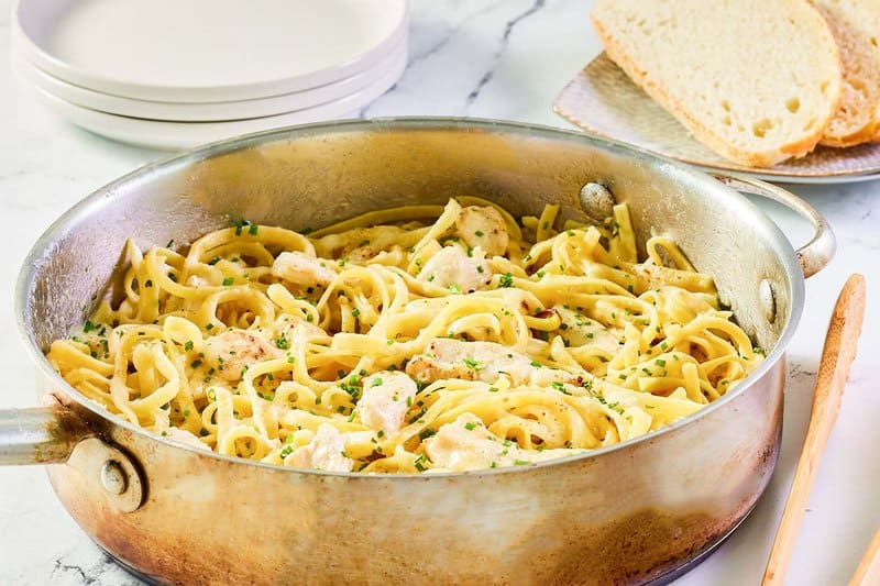 Chicken alfredo pasta in a pot.