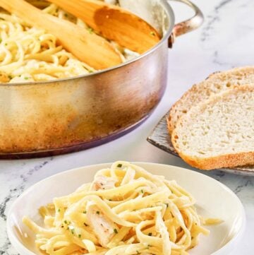 Chicken alfredo in a pot and a serving on a plate.