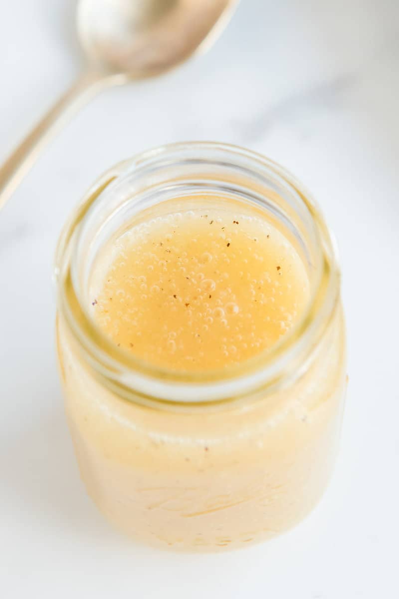 Overhead view of copycat Panera fuji apple salad dressing in a mason jar.