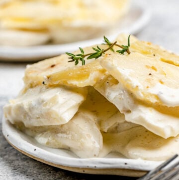 Scalloped potatoes without cheese on plates.