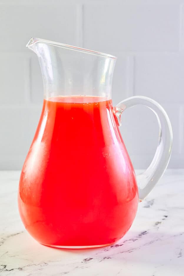 Strawberry mimosa in a pitcher.