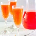 Strawberry Mimosa in champagne glasses.