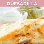 Closeup of copycat Taco Bell chicken quesadilla, sour cream, and quacamole.