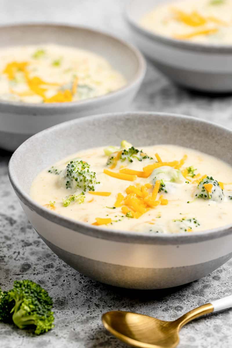 Three cheese broccoli soup in three bowls.