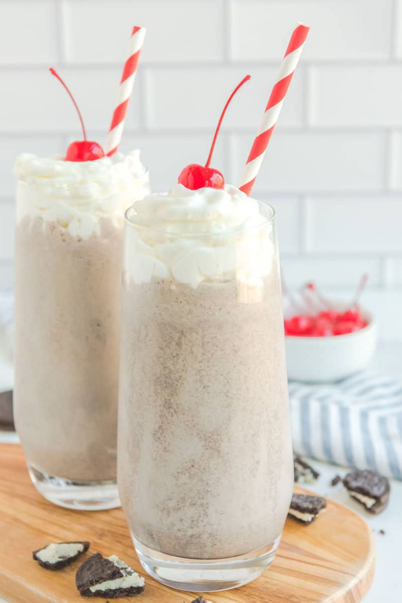 Copycat Chick Fil A cookies and cream milkshakes on a wood board.