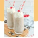 Two homemade Chick Fil A cookies and cream milkshakes on a wood board.