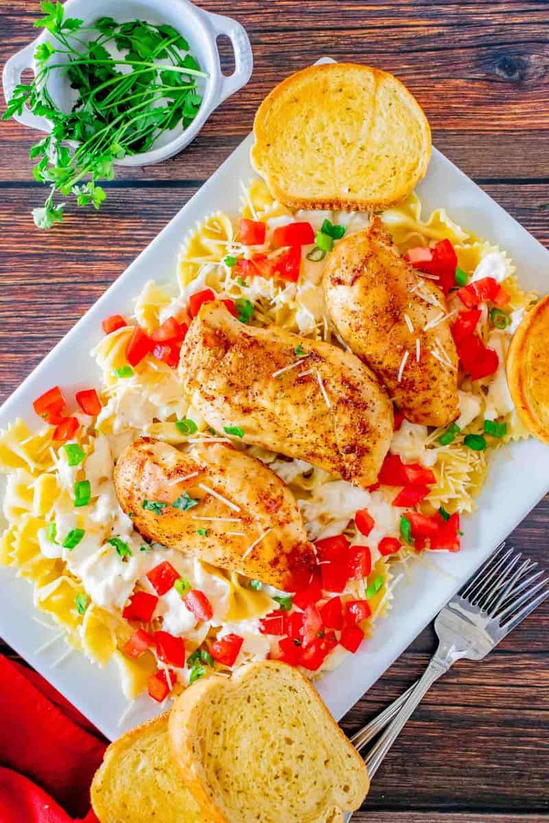 Overhead view of copycat Chili's Cajun yellow pasta on a platter.