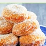 Several homemade Chinese sugar donuts on a plate.