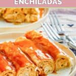 Cream cheese chicken enchiladas and two forks.