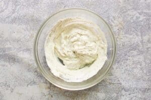 Dill potato salad dressing in a glass bowl.