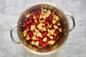 Chopped red potatoes in a pot.