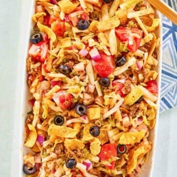 Overhead view of frito taco salad on a platter.