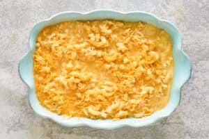 Mac and cheese in a baking dish before baking.