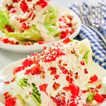 Maytag buttermilk blue cheese dressing and chopped tomatoes on iceberg lettuce wedges.