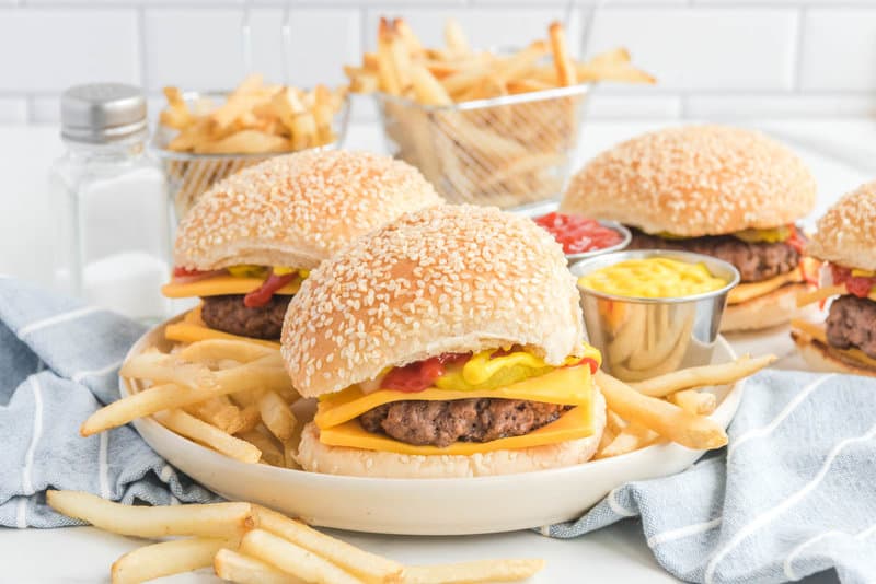 Copycat McDonald's quarter pounder burgers with cheese and french fries.