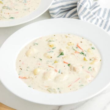 Copycat Olive Garden chicken gnocchi soup in two bowls.