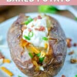 Closeup of homemade Outback Steakhouse loaded baked potato on a plate.