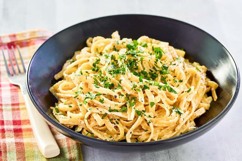 A vessel  of copycat Pasta House fettuccine alfredo.