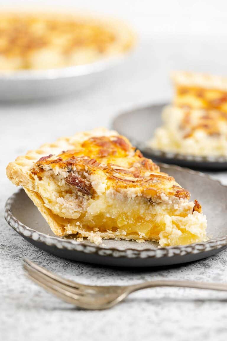 Pineapple pie slice with the pie in the background.