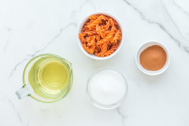 Copycat Taco Bell cinnamon twists ingredients on a marble surface.