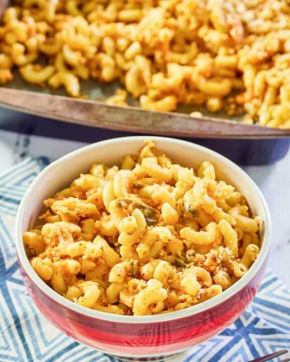 Spicy mac and cheese in a baking dish and bowl.