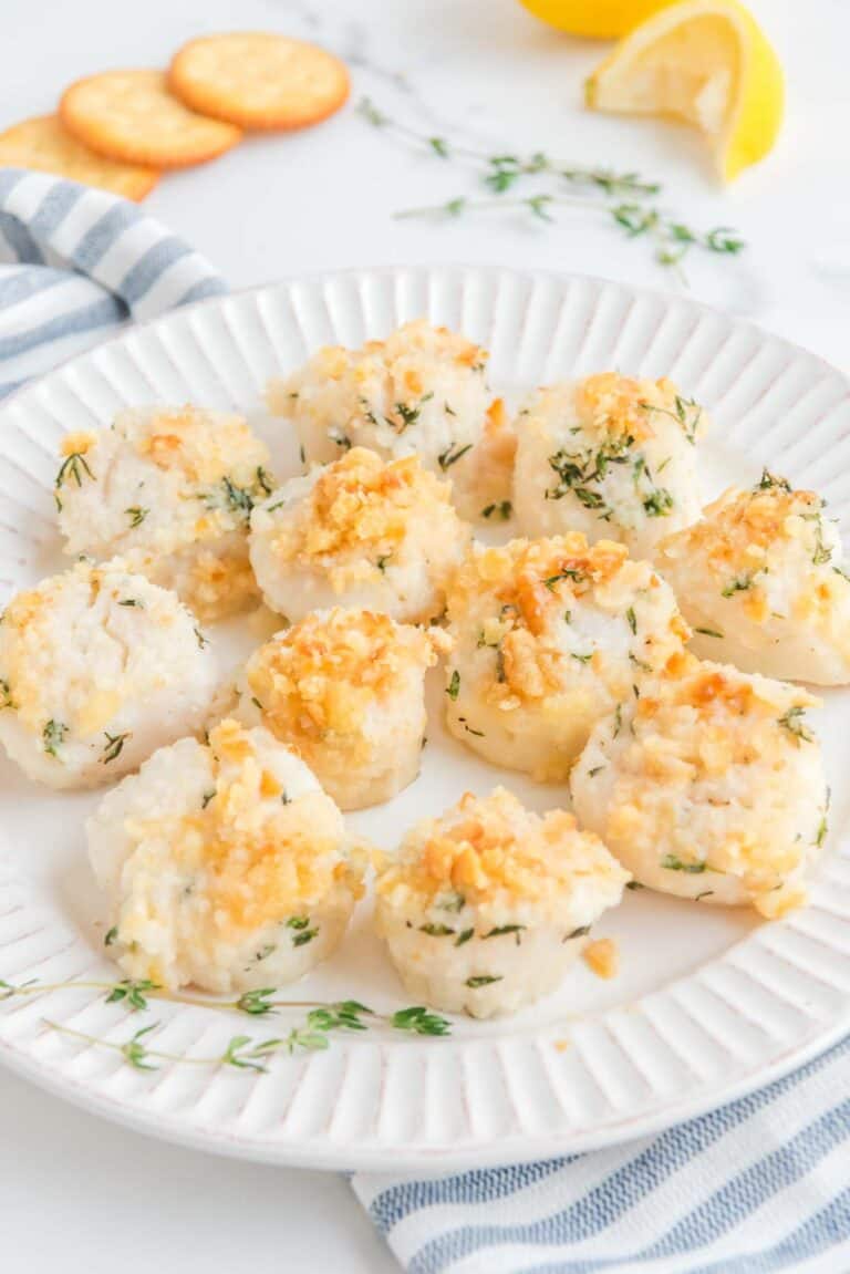 Baked Scallops with Ritz cracker topping on a plate.