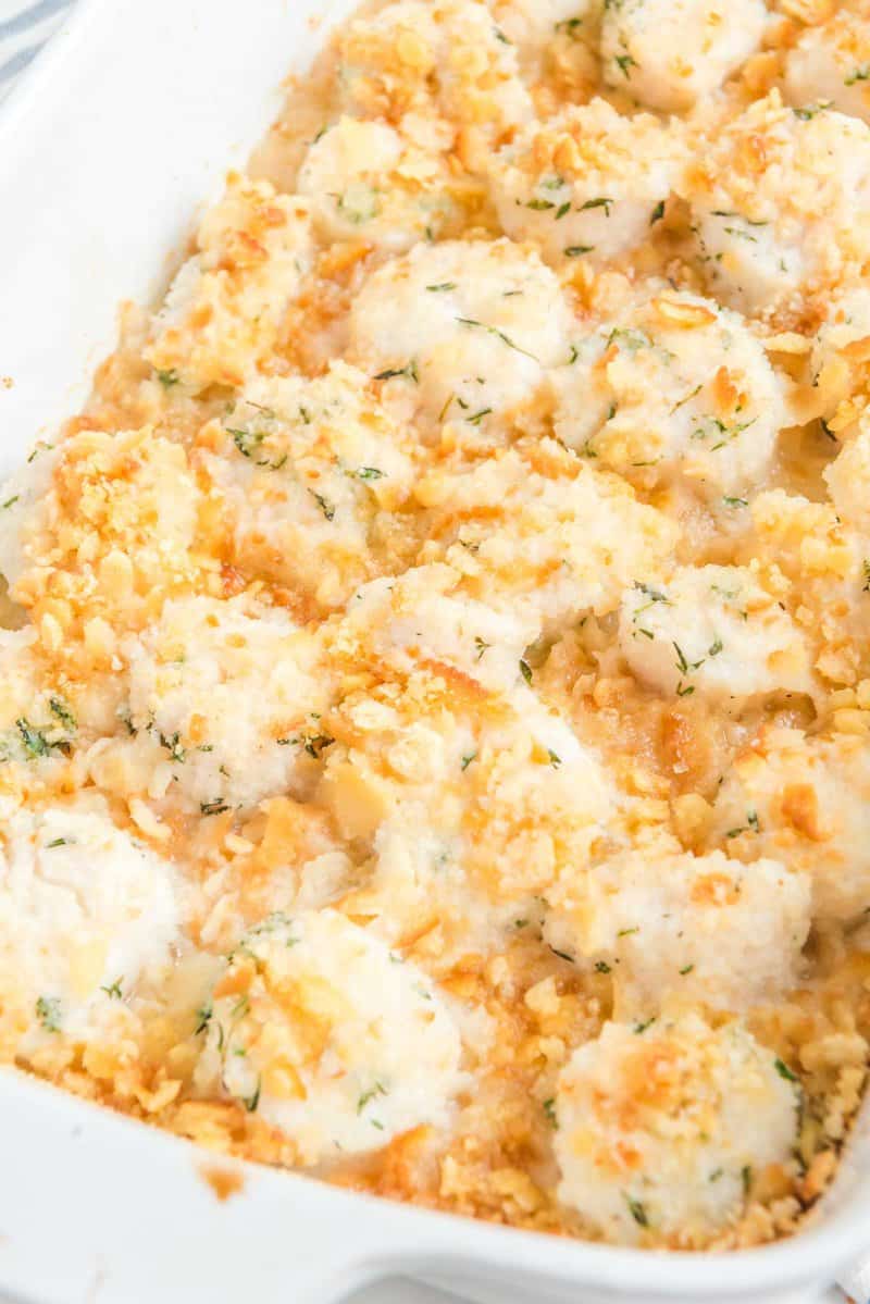 Baked scallops with Ritz cracker topping in a baking dish.