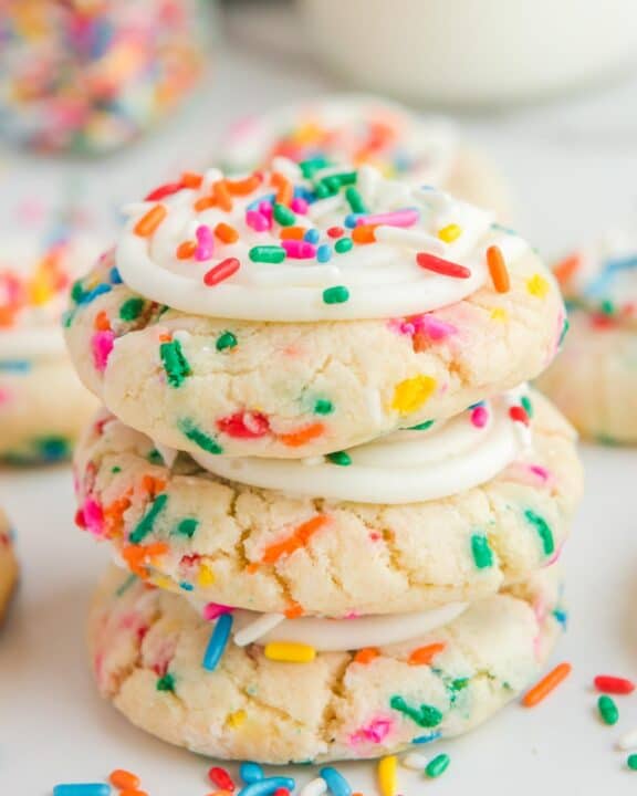 Copycat Crumbl birthday cake cookies in a stack.