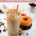 A glass of homemade Dunkin iced coffee and donuts next to it.