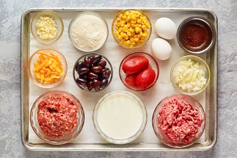 Hamburger corn casserole ingredients on a tray.