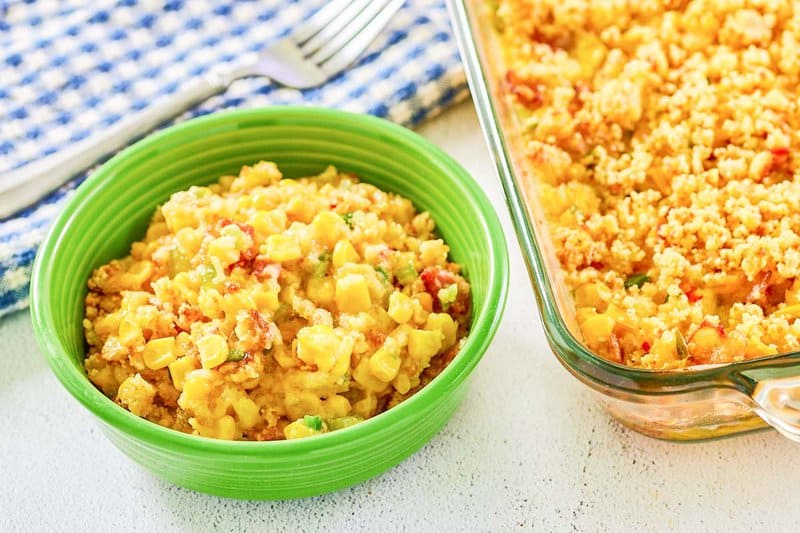 Copycat Luby's Spanish Indian baked corn casserole in a bowl and glass baking dish.
