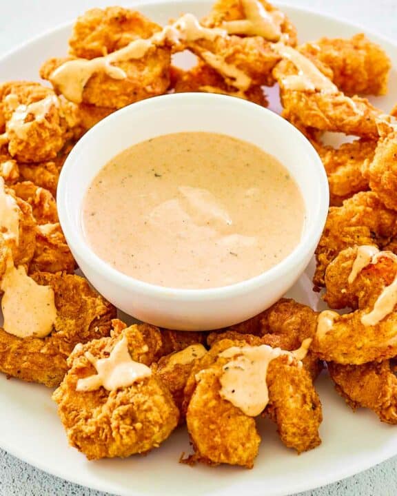 Copycat Outback bloomin fried shrimp and a bowl of bloomin sauce.