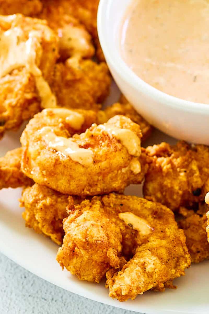 Closeup of copycat Outback bloomin fried shrimp and dipping sauce.