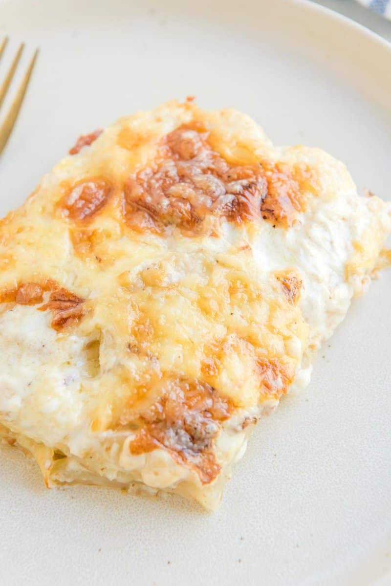 Closeup of a serving of potato au gratin on a plate.