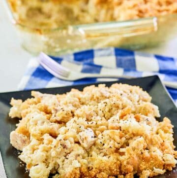 Ritz cracker chicken casserole in a glass baking dish and a serving on a plate.