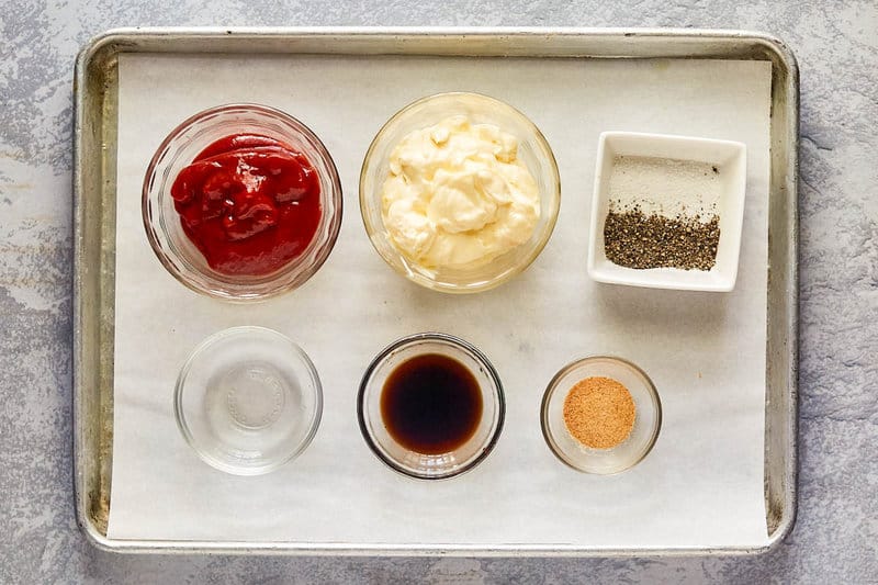 Copycat Zaxby's zax condiment  ingredients connected  a tray.