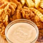 Copycat Zaxby's zax sauce, fried chicken fingers, and crinkle-cut fries.
