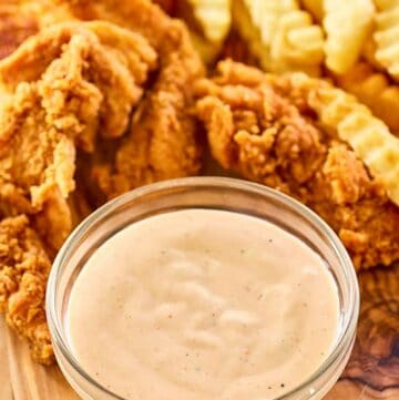 Copycat Zaxby's zax sauce, fried chicken fingers, and crinkle-cut fries.