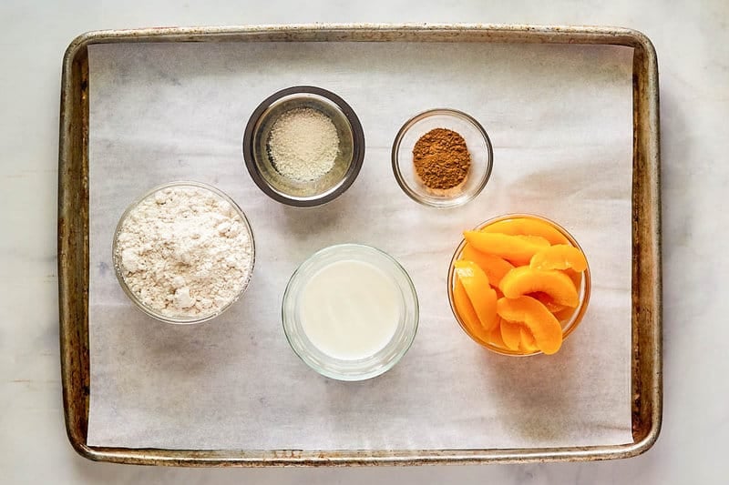 Bisquick peach cobbler ingredients on a tray.