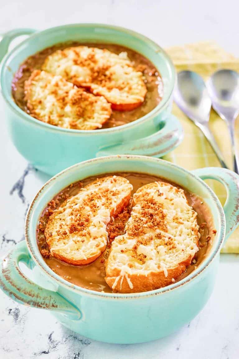 Copycat Brennan's French onion soup in two soup crocks.