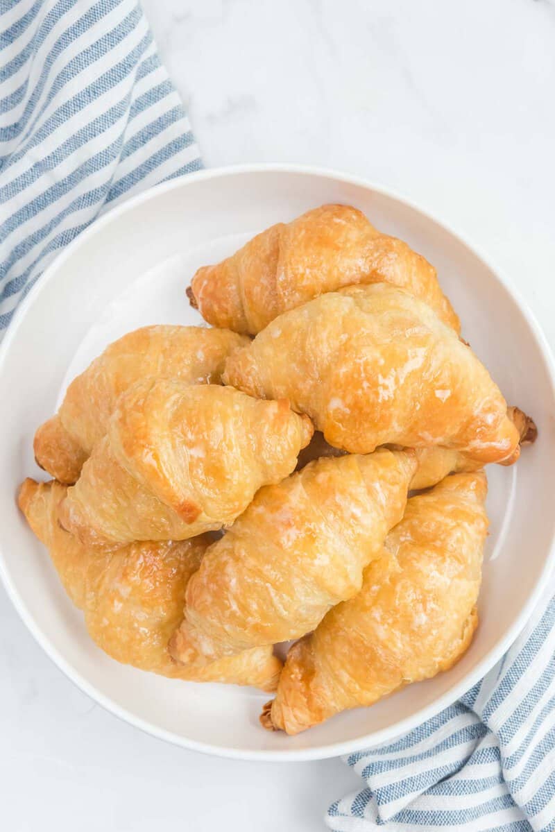 Overhead view of copycat Cheddar's honey butter croissants on a plate.