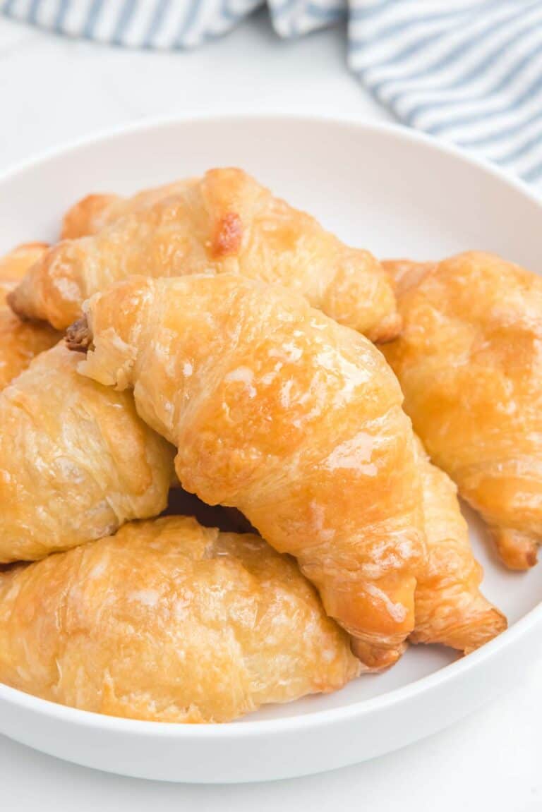 Copycat Cheddar's honey butter croissants on a plate.
