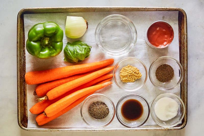 Ingredients for copper penny carrots connected  a tray.