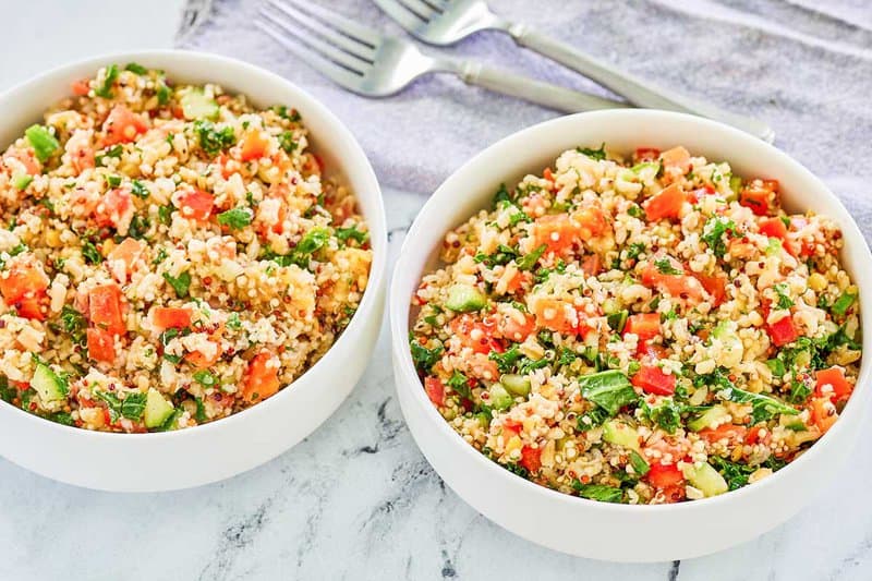 Copycat Costco quinoa salad in two white bowls.