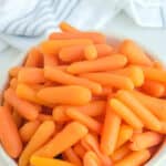 Copycat Cracker Barrel baby carrots in a white bowl.