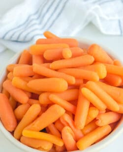 Copycat Cracker Barrel baby carrots in a white bowl.