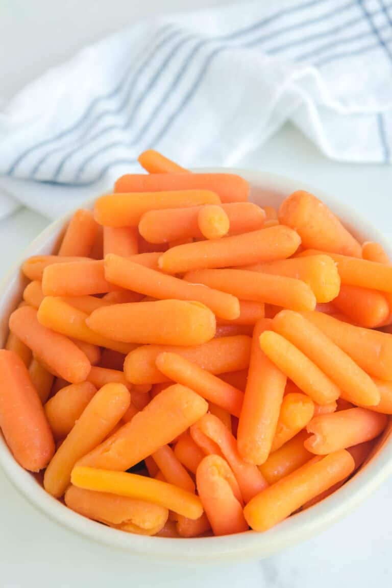 Copycat Cracker Barrel baby carrots in a white bowl.