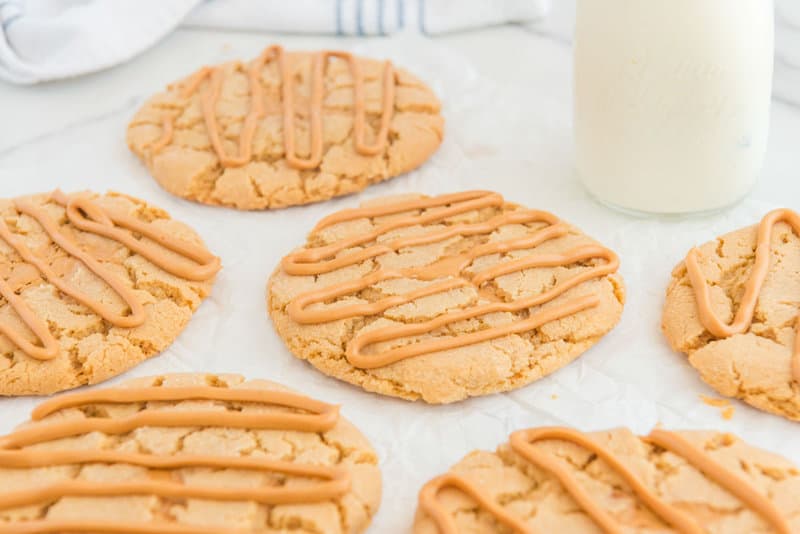 Copycat Crumbl ultimate peanut butter cookies on parchment paper.