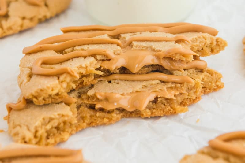 Closeup of a copycat Crumbl ultimate peanut butter cookie broken in half.