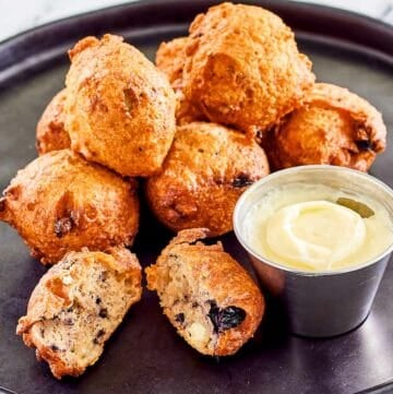 Copycat Denny's blueberry pancake puppies and cheesecake dip on a plate.